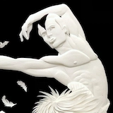 A close-up image of paper-cut artwork depicting a male ballet dancer from Matthew Bourne's production of Swan Lake.